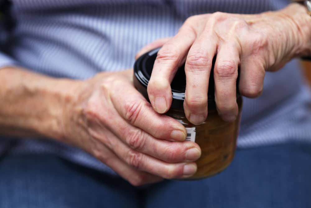 Arthritis in the hands opening a jar